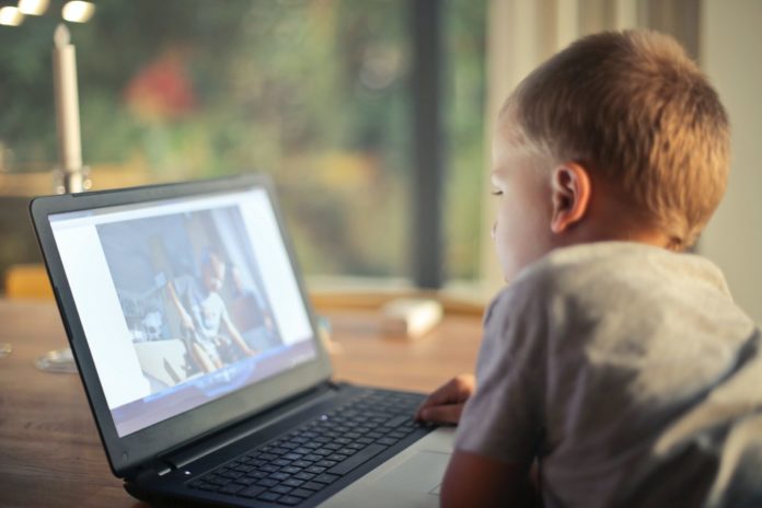boy-watching-video-using-laptop-821948-scaled