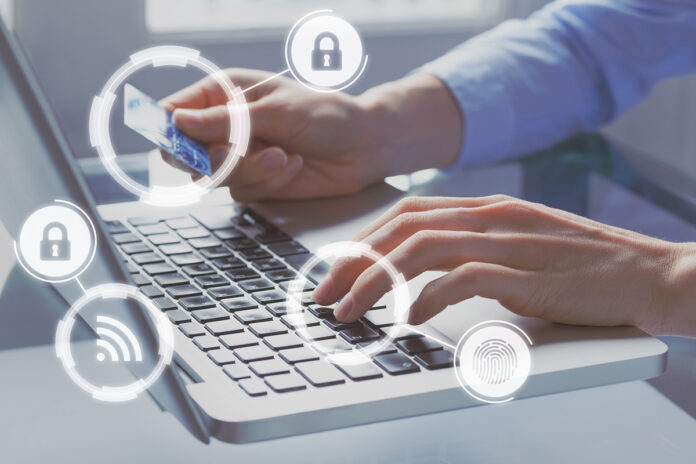 Secure online payment with credit card on internet shop e-commerce technology, concept with icons and person paying on computer website in background